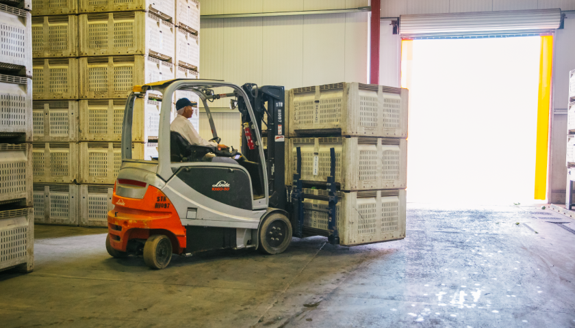 Shipping containers or trucks representing logistics and transportation workers